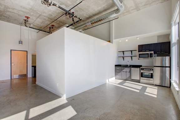A large white box sits in the middle of a kitchen at RiDE at RiNo Apartments, Denver, CO