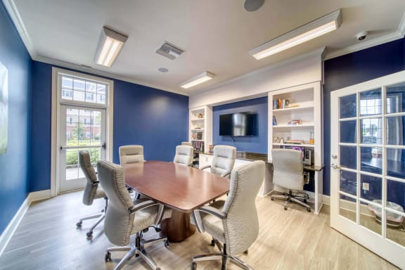 a meeting room with a table and chairs at Meridian Obici, Suffolk, VA
