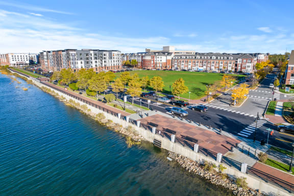 an aerial view of a river with buildings on the side of it at Harbor Pointe, New Jersey