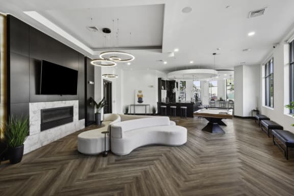 a large living room with a white couch and a television at Metro 303, New York