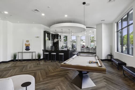 a game room with a pool table and a bar at Metro 303, New York, 11550