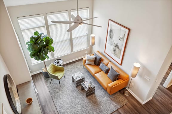 an overhead view of a living room with a couch and a ceiling fan at Metro 303, Hempstead, NY 11550