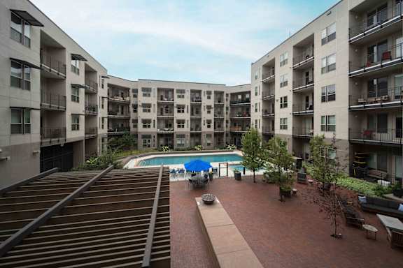 Apartment complex with a pool in the middle at Regatta Sloans Lake Apartments, Denver, Colorado