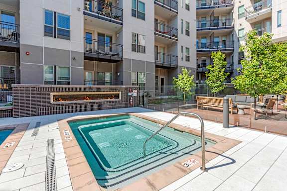 A small pool in a courtyard surrounded by buildings at Regatta Sloans Lake Apartments, Denver, CO