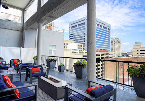 Rooftop terrace with firepit and city views at 222 Saratoga Apartments, Baltimore, MD