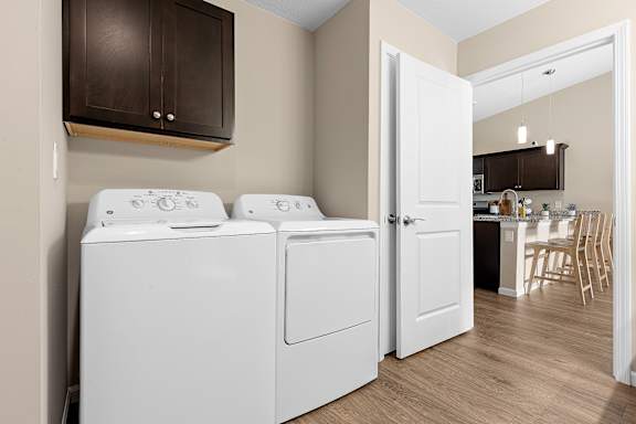 A laundry room with a washer and dryer.