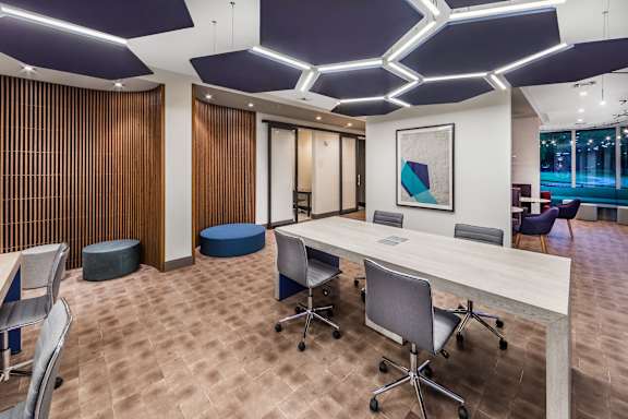 A conference room with a long table and chairs. at Morea Apartments, Pompano Beach, 33062