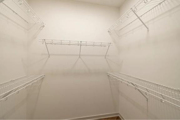 Empty white shelves in a room.
