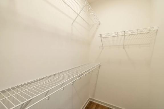 Empty wire shelving in a room.
