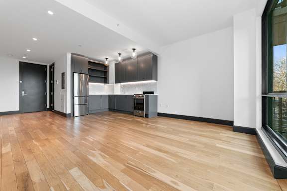 Open concept living space with hardwood floors at 1134 Fulton Street Apartments, Brooklyn, New York