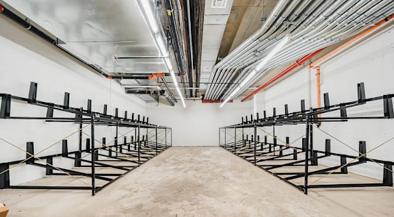 Bicycle storage room with ceiling mounted racks at 260 Gold Apartments, Brooklyn, New York