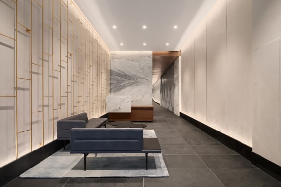 a lobby with couches at The Paxton, Brooklyn, NY
