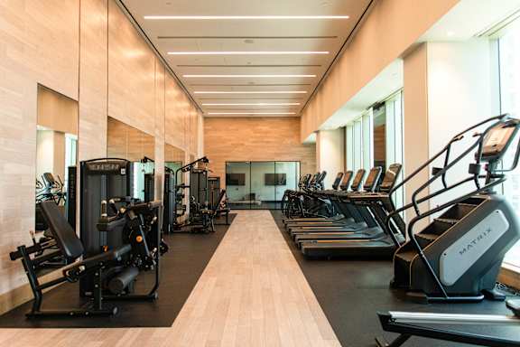 A gym with treadmills and exercise equipment.