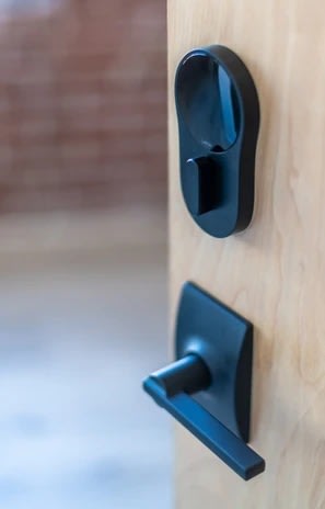 a wooden door with black handles and a black handle at The 22 Apartments, St. Louis Missouri