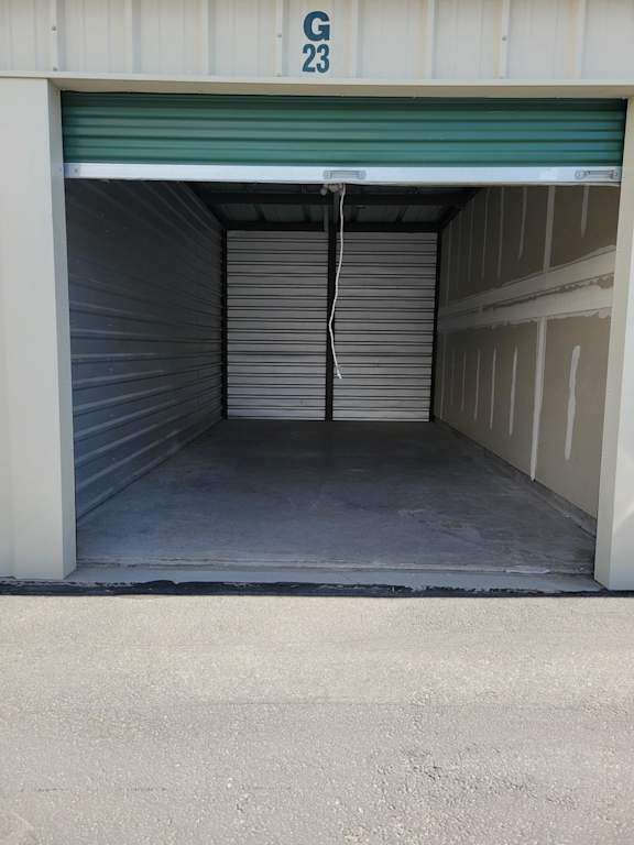 A storage unit with the number G23 on the door.