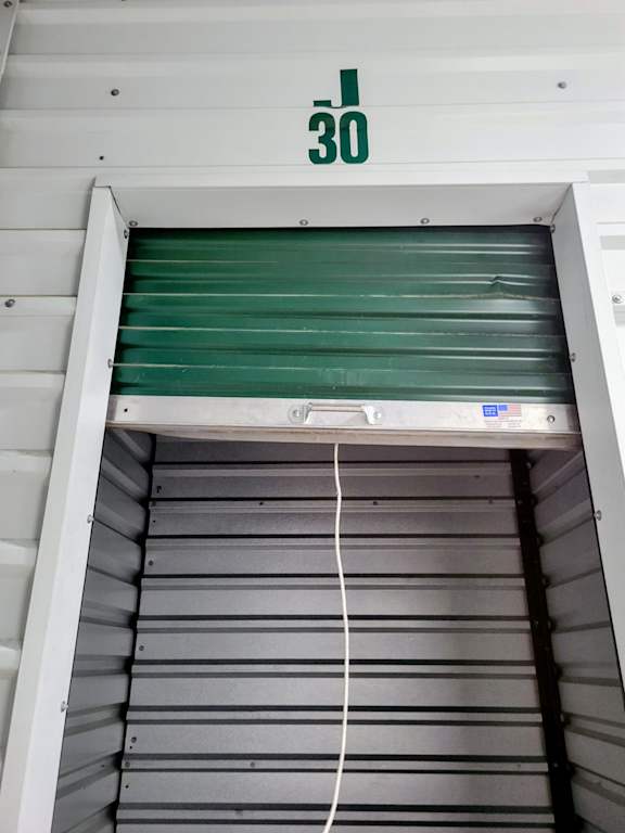 A storage unit with the number 30 on the wall.