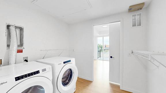 A laundry room with a washer and dryer.