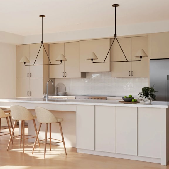 A kitchen with a white countertop and beige chairs.