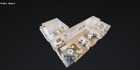 A top-down view of a house layout with a kitchen, living room, and dining area.
