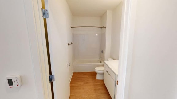 a room with a lot of white walls and stairs