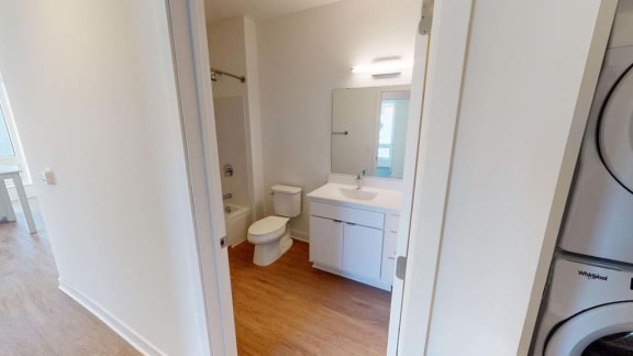 a bathroom with a toilet sink and a mirror