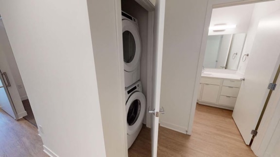 a washer and dryer in a white closet