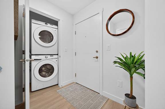A small room with a washer and dryer in it.