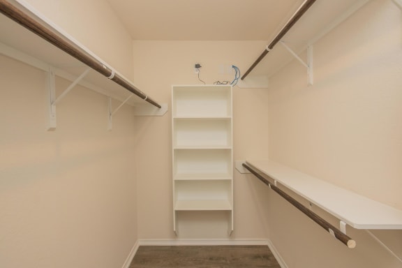 a walk in closet in a 555 waverly unit at The Village at Granger Pines, Texas