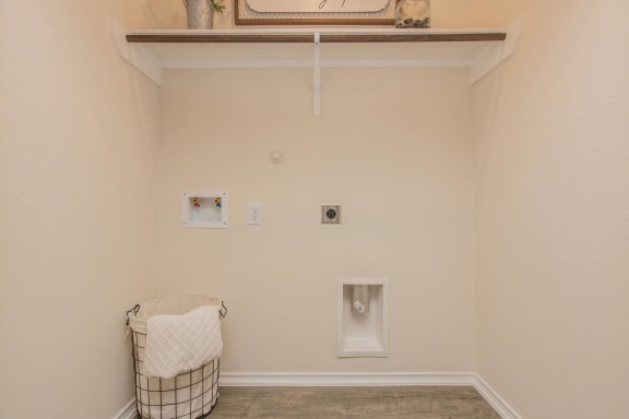 a laundry room with two washer and dryer at The Village at Granger Pines, Conroe, 77302