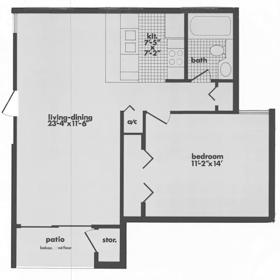 A floor plan of a house with a living area, bedroom, patio, and storage space.