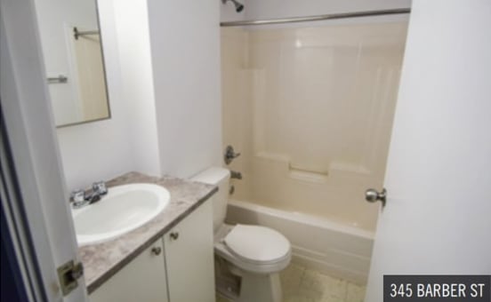 a bathroom with a sink toilet and bathtub