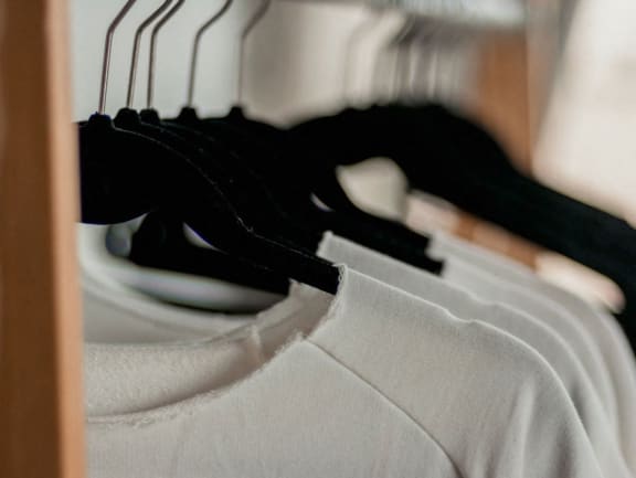 a close up of a white shirt on a rack