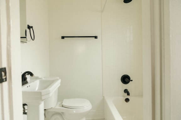 a bathroom with a toilet sink and bathtub