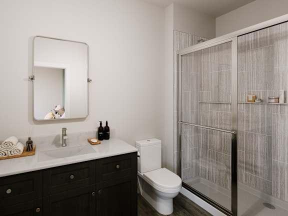 a bathroom with a toilet sink and shower
