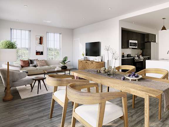 a living room and dining room with a table and chairs