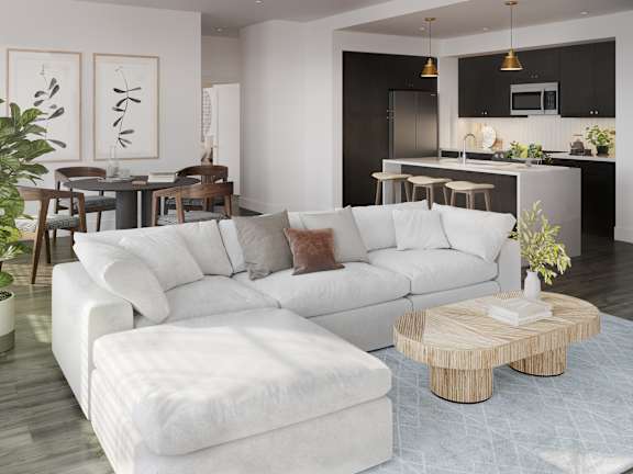 a living room with a white couch and a coffee table