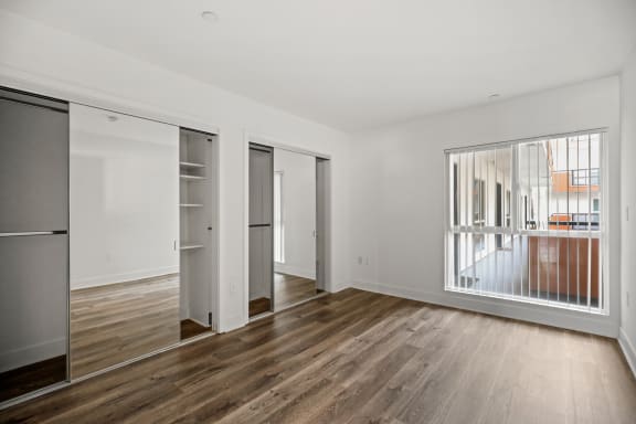 Hall Bedroom with Dual Mirrored Closets