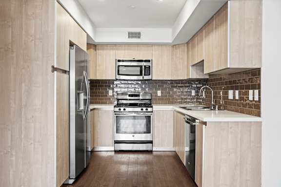 U Shaped Kitchen with Stainless Appliances and Pantry