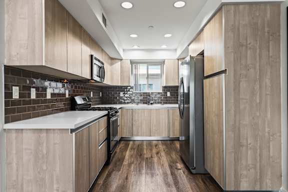 U Shaped Kitchen with Stainless Appliances and Pantry