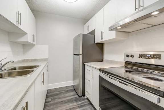 Kitchen with stainless steel appliances and white cabinets  at Platts Crossing, London, ON, N6H 4P4
