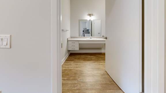 A bathroom with a sink and mirror.