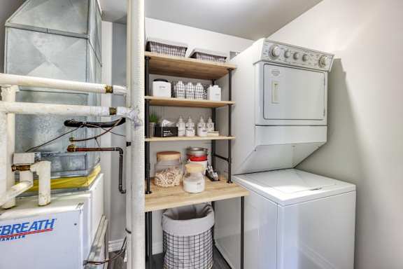 Laundry closet with storage.