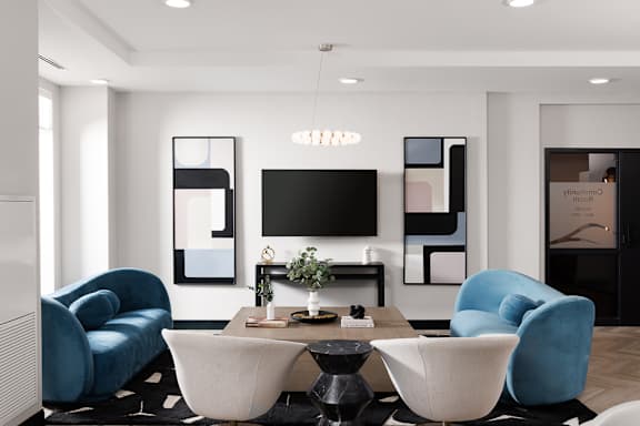 A modern living room with a blue velvet chair and a white sofa at 1600 Hyde Park Village Apartments, London