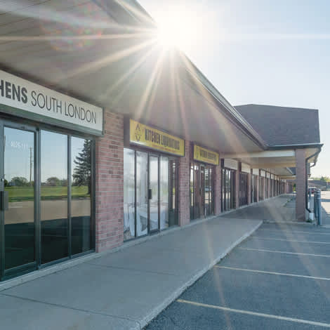a picture of the front of a building with a blue sky in the background