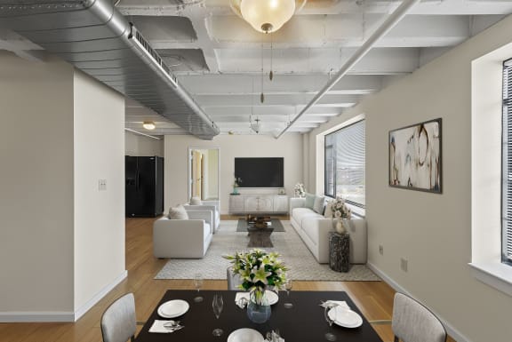 a living room with a table and chairs and a couch