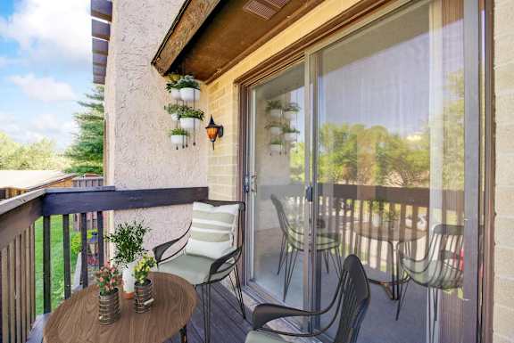 A patio with a table and chairs is shown.