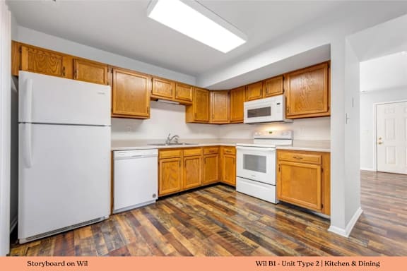 A kitchen with wooden cabinets and a white refrigerator.