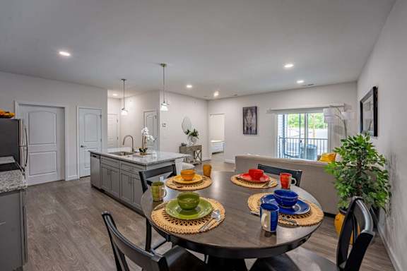 A modern dining room with a table set for a meal.