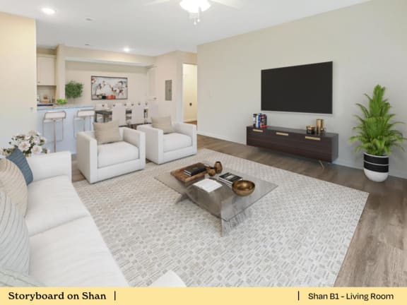 a living room with two white couches and a coffee table