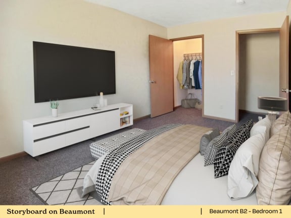 a bedroom with a bed and a television